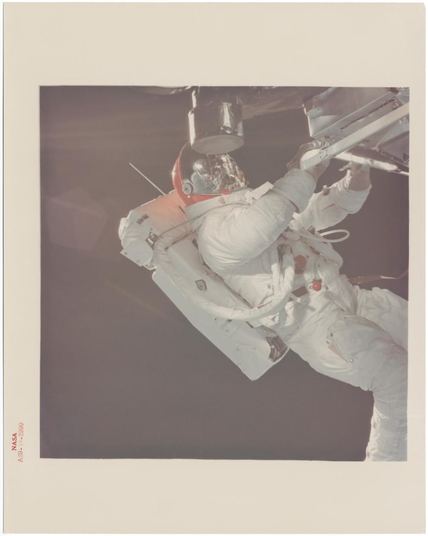 [Apollo 9] THE FIRST APOLLO EVA: Russell Schweickart floating freely outside LM Spider, viewed f...: [Apollo 9] THE FIRST APOLLO EVA: Russell Schweickart floating freely outside LM Spider, viewed from CSM Gumdrop's hatch David Scott, March 3-13, 1969 Printed 1969. Vintage chromogenic print on fibre-b