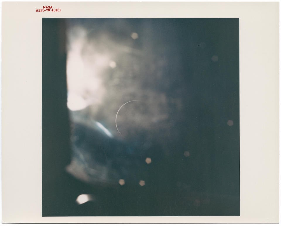 [Apollo 15] EXTRAORDINARY VIEW OF EARTH: a slender, ethereal crescent almost entirely in shadow ...: [Apollo 15] EXTRAORDINARY VIEW OF EARTH: a slender, ethereal crescent almost entirely in shadow Alfred Worden, James Irwin or David Scott, 26 July - 7 August 1971 Printed 1971. Vintage chromogenic pri