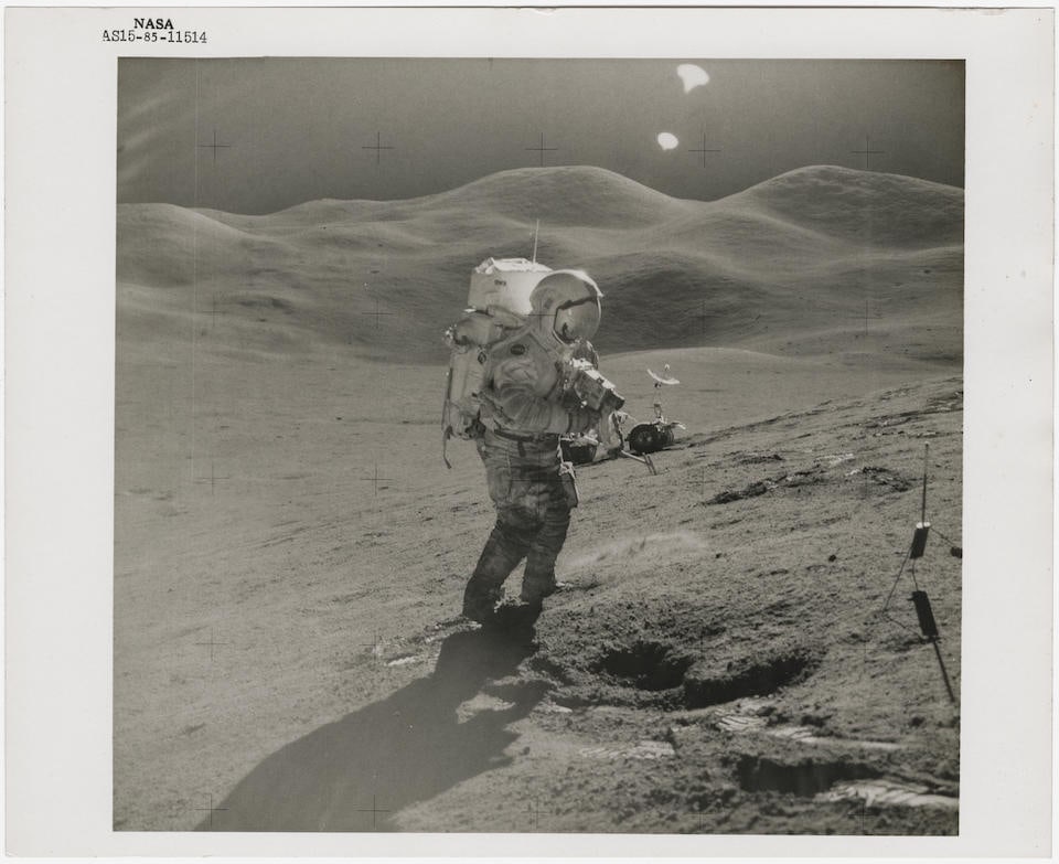 [Apollo 15] DAVID SCOTT TAKING PHOTOGRAPHS IN FRONT OF THE HADLEY-APENNINE MOUNTAINS AT STATION ...: [Apollo 15] DAVID SCOTT TAKING PHOTOGRAPHS IN FRONT OF THE HADLEY-APENNINE MOUNTAINS AT STATION 6 James Irwin, 26 July - 7 August, 1971, EVA 2 Printed 1971. Vintage gelatin silver print on fibre-based