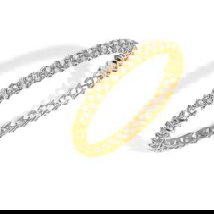 MCTEIGUE: AN 18K GOLD, PLATINUM AND DIAMOND BANGLE BRACELET: MCTEIGUE: AN 18K GOLD, PLATINUM AND DIAMOND BANGLE BRACELET Hinged bracelet of open-work design with 43 round diamonds weighing approximately 1.95 carats total, with maker's mark, inner circumference