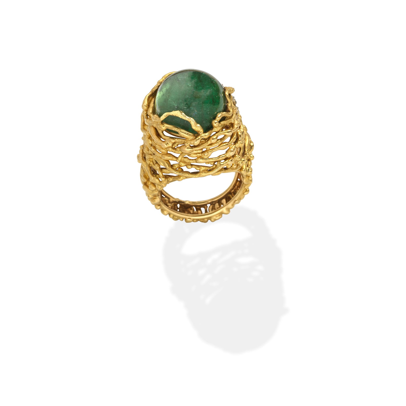 GRIMA: TOURMALINE RING,: GRIMA: TOURMALINE RING, 1973 The tourmaline cabochon within an openwork 18 carat gold textured mount of abstract form, signed GRIMA, maker's mark AG.Ltd, London hallmark, ring size approx. P½ (le