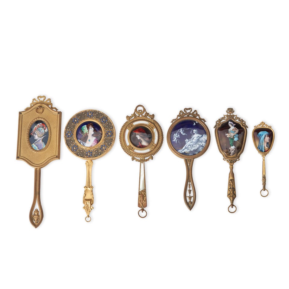SIX HAND MIRRORS WITH ENAMEL PLAQUES France, early 20th century, enamels on copper, gilt metal f... (1 of 2)