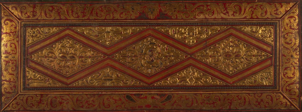 A GILT WOOD AND POLYCHROME MANUSCRIPT COVER TIBET, CIRCA 14TH CENTURY (1 of 2)