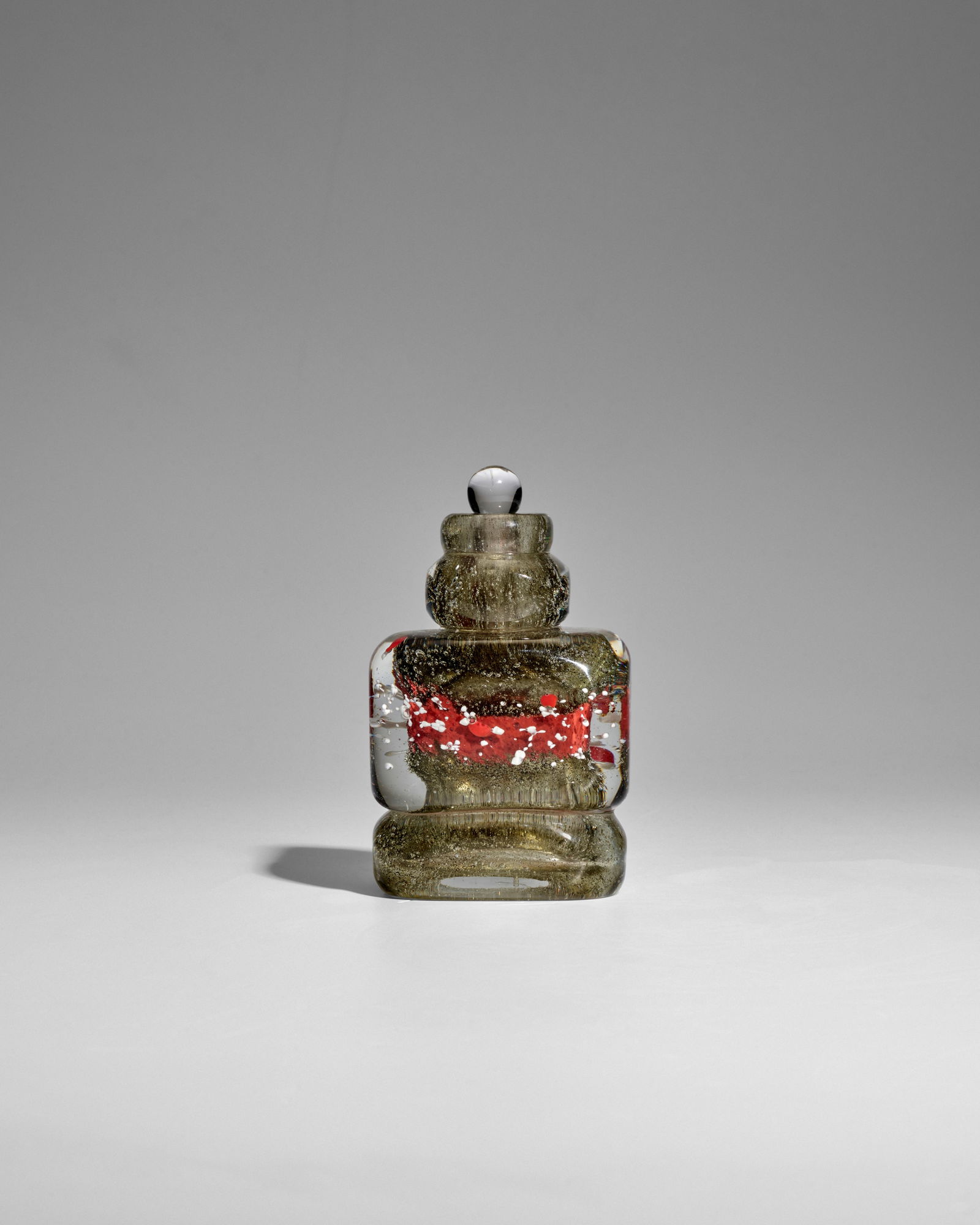 MAURICE MARINOT (1882-1960) Rare Flacon Meplat with Stopper1930model no. 1793, internally decora...: MAURICE MARINOT (1882-1960) Rare Flacon Meplat with Stopper 1930 model no. 1793, internally decorated glass, engraved 'marinot' height 5 1/4in (13.3cm); width 3 1/4in (8cm) Footnotes: Provenance Adrie