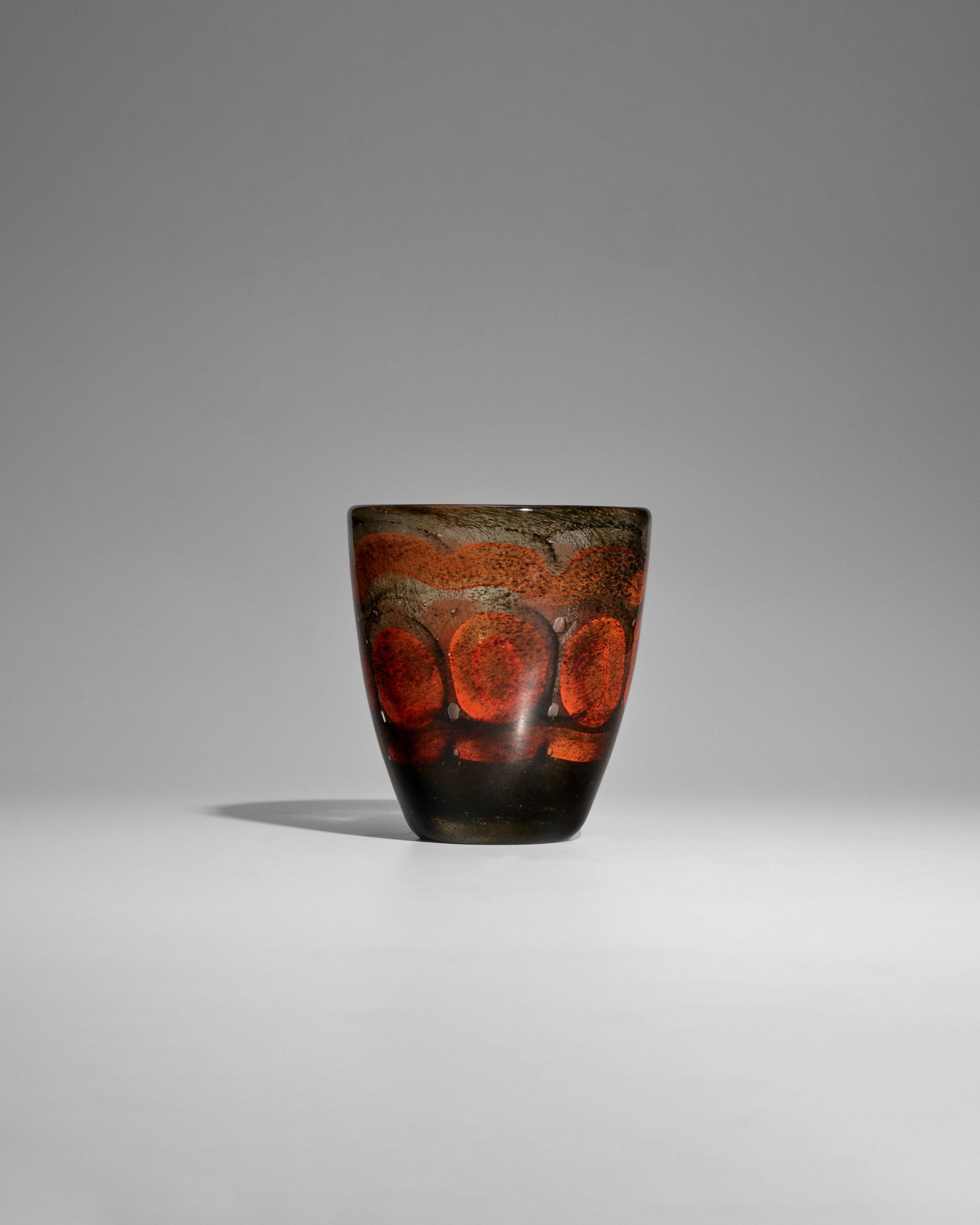MAURICE MARINOT (1882-1960) Vasecirca 1923model no. 556, internally decorated glass, acid stamp ...: MAURICE MARINOT (1882-1960) Vase circa 1923 model no. 556, internally decorated glass, acid stamp 'marinot', paper label '556' height 6 1/2in (16.5cm); diameter 6in (15cm) Footnotes: Bonhams would lik
