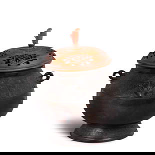 AN ARCHAISTIC BRONZE YOU-FORM CENSER Qing dynasty (wood cover and stand): AN ARCHAISTIC BRONZE YOU-FORM CENSER Qing dynasty Cast with a pair of encircling carps at the interior base. 6 1/4in (15.8cm) high (wood cover and stand). Footnotes: &#28165; &#37509;&#20223;&#21476;&