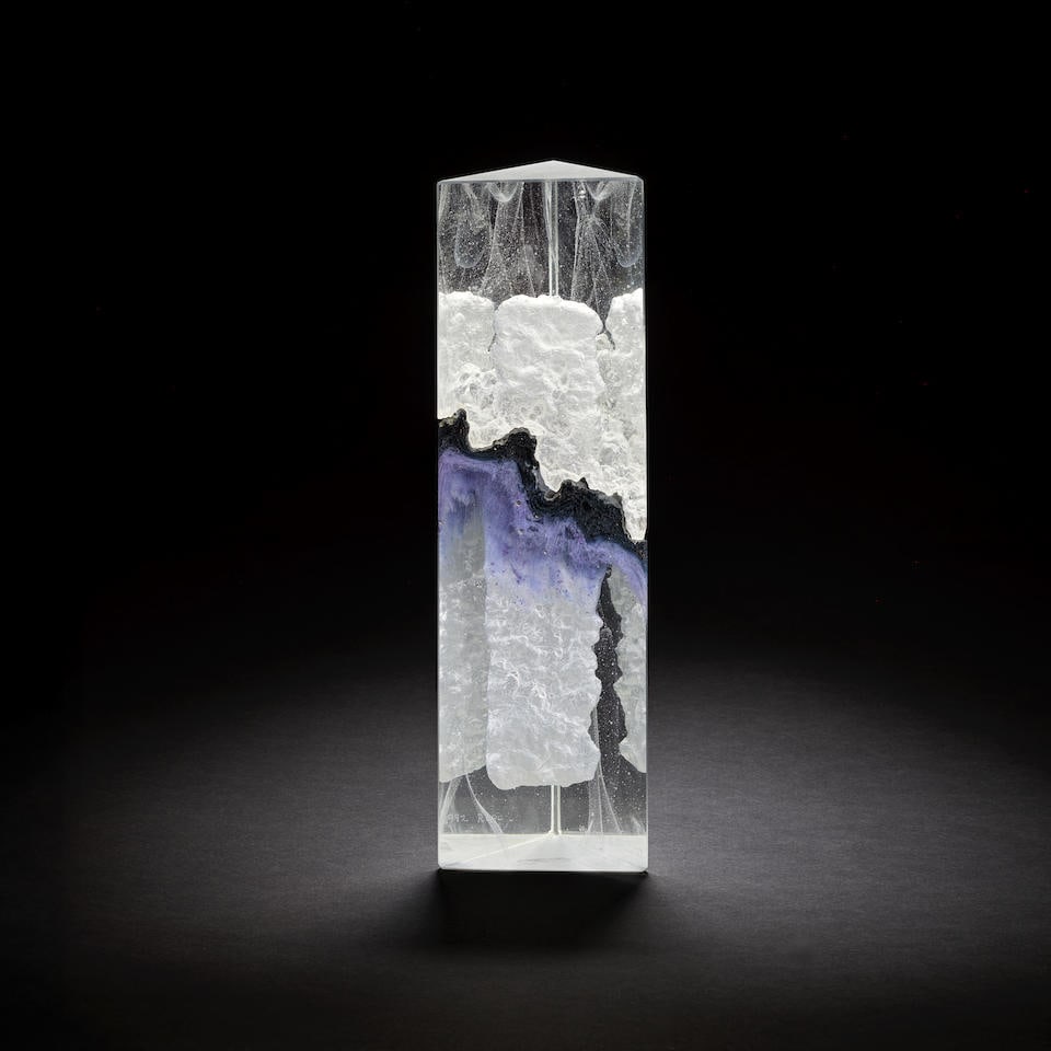 Colin Reid 'R494' lidded box, 1992: Colin Reid 'R494' lidded box, 1992 Kiln and lost wax cast glass, polished and sandblasted with lilac and black pigment inclusions. 32 x 9.7 x 8 cm Base etched Colin Reid 1992 R494. Footnotes: Provenan