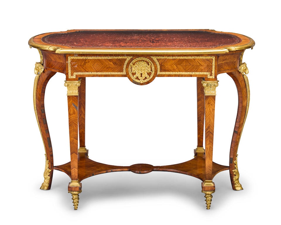A fine late 19th century tulipwood and gilt bronze mounted bureau plat English in the Louis XIV ...: A fine late 19th century tulipwood and gilt bronze mounted bureau plat English in the Louis XIV style and in the manner of André-Charles Boulle The shaped top inset with a gilt tooled leather wri