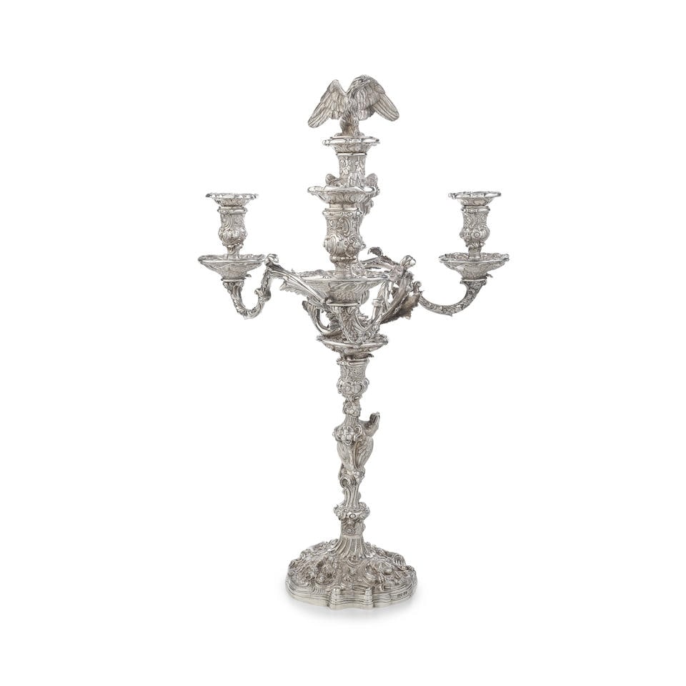 An impressive George IV silver four-light candelabra London 1825, probably William Elliot: An impressive George IV silver four-light candelabra London 1825, probably William Elliot After a design by Paul de Lamerie, with three scrolling foliate and acanthus leaf branches leading to removab