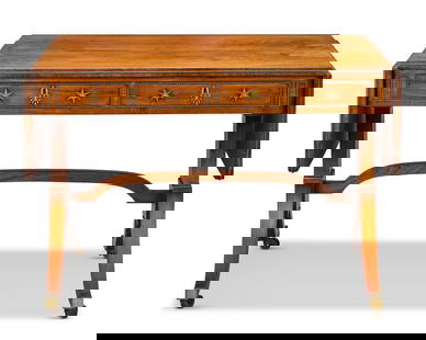 A Regency rosewood and gilt brass mounted sofa table In the manner of John Mclean: A Regency rosewood and gilt brass mounted sofa table In the manner of John Mclean The hinged rectangular top above a pair of frieze drawers and opposing dummy drawers on end supports and downswept leg