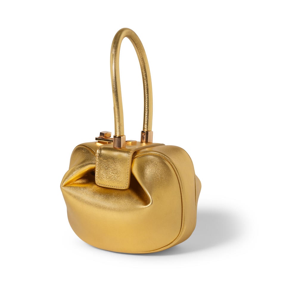 GABRIELA HEARST: METALLIC NINA BAG: GABRIELA HEARST: METALLIC NINA BAG • Metallic Gold Nappa Leather • Gold Tone Hardware • Turn Lock Closure • Rolled Handle • Leather Interior and Single Interior Pocket wi