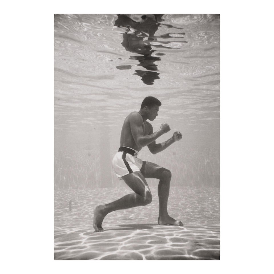 Flip Schulke (1930-2008); Ali Underwater;: Flip Schulke (1930-2008) Ali Underwater, 1961 Gelatin silver print, printed before 2003; signed in pencil on the reverse, framed, an Ariel Meyerowitz Gallery label on the reverse. 13 x 8 3/4 in. (33 x