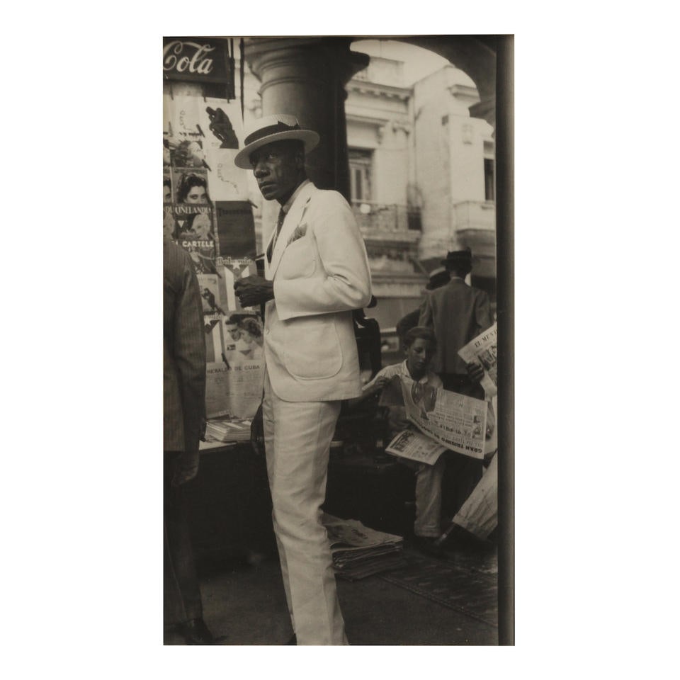 Walker Evans (1903-1975); Citizen in Downtown Havana;: Walker Evans (1903-1975) Citizen in Downtown Havana, 1933 Gelatin silver print; numbered 'L-117' in an unidentified hand in pencil on the reverse, framed. 8 7/8 x 5 1/8 in. (22.5 x 13 cm.) sheet 9 7/8