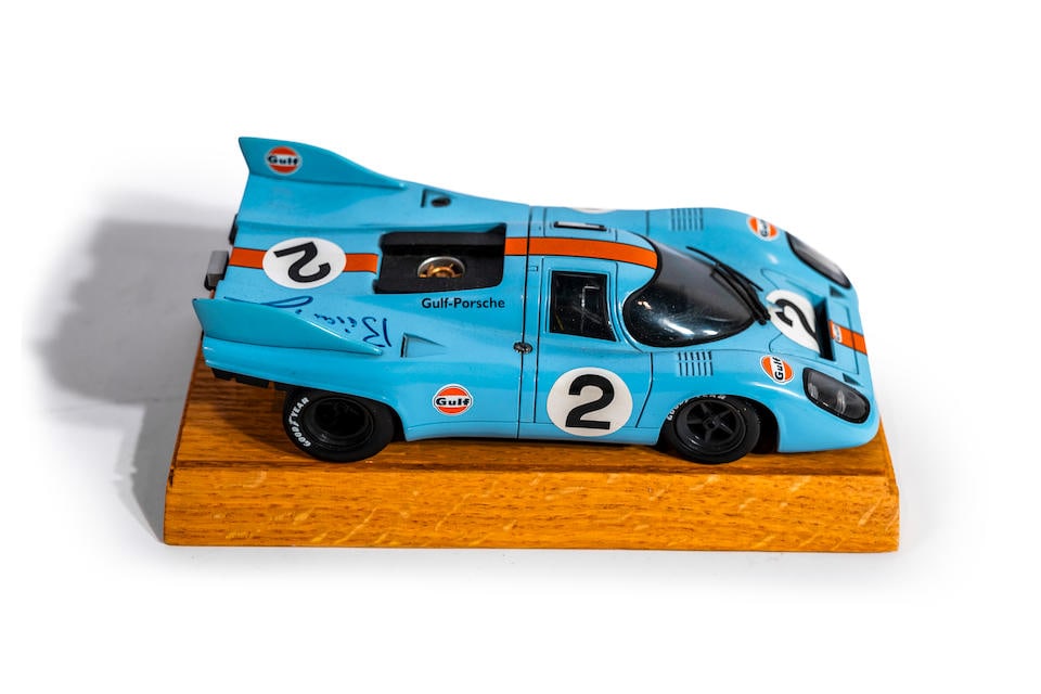 A 1:18 scale model Porsche 917 signed by Brian Redman,: A 1:18 scale model Porsche 917 signed by Brian Redman, signed in blue marker over right rear quarter panel, die-cast, 4'H x 4'W x 17'L. Lot to be sold without reserve. For further information on this