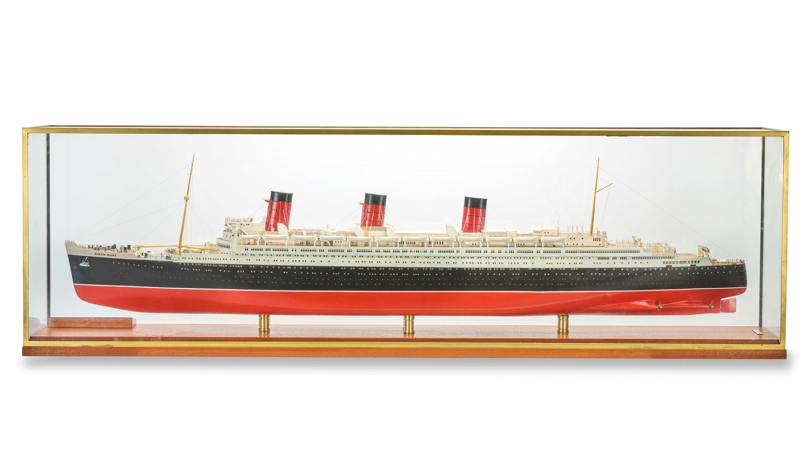 A 1:200 scale Model of the Cunard Ocean Liner Queen Mary,: A 1:200 scale Model of the Cunard Ocean Liner Queen Mary, built by Norman Hill, the well detailed model with veneered oak decking and silver wire rigging, the black and maroon painted hull with brass