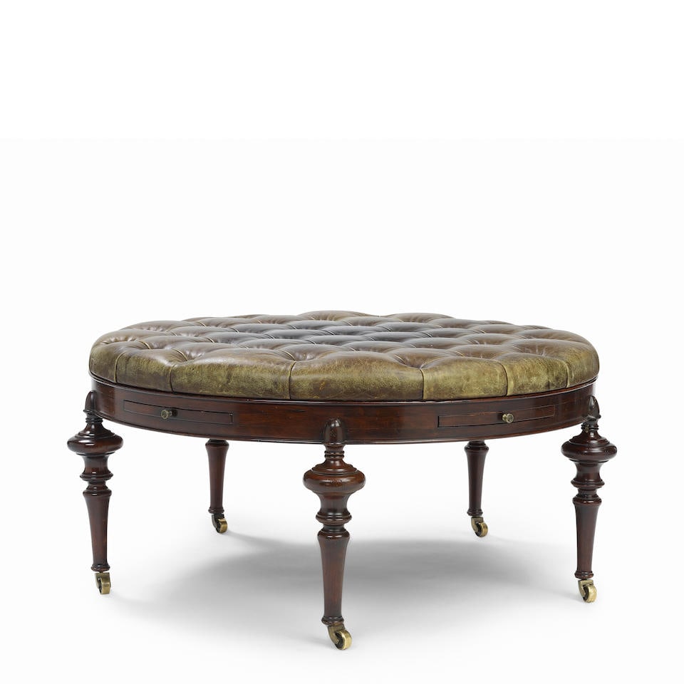A BROWN TUFTED LEATHER AND MAHOGANY ROUND OTTOMAN COFFEE TABLE (1 of 6)