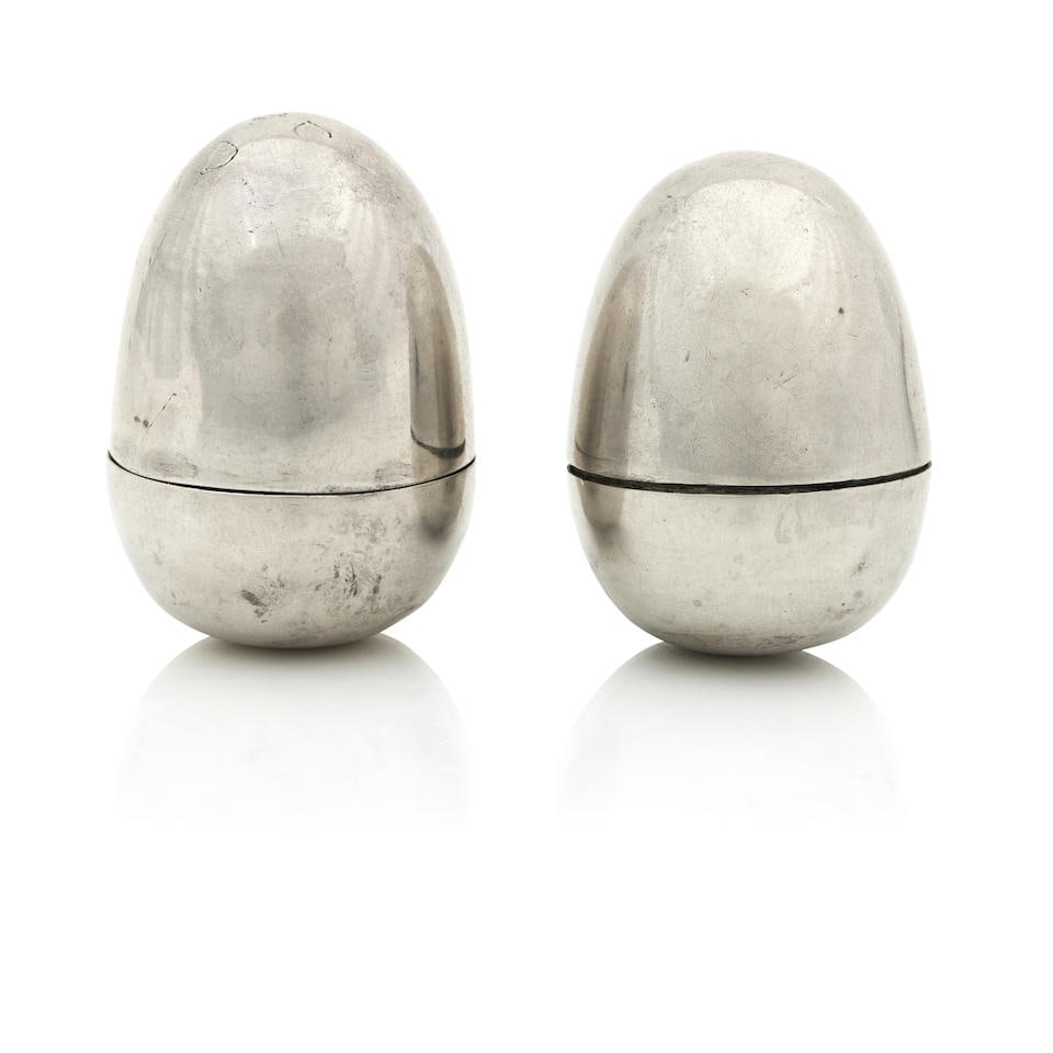 Two George III silver nutmeg graters One with Chester marks, maker and date letter obscure Circa...: Two George III silver nutmeg graters One with Chester marks, maker and date letter obscure Circa 1790 Both of egg form, the second example unmarked, height 4.2cm. (2) For further information on this