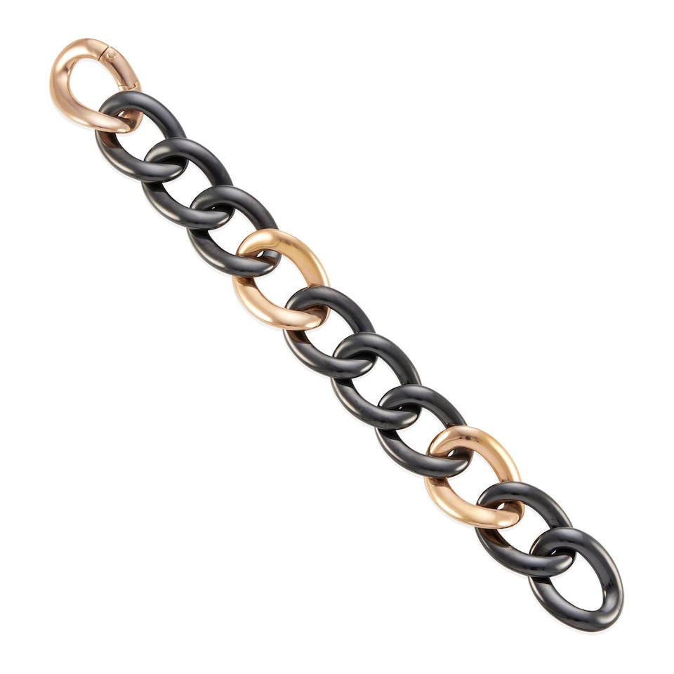 MARCHISIO: 18K GOLD AND HEMATITE LINK BRACELET: MARCHISIO: 18K GOLD AND HEMATITE LINK BRACELET • 18k rose gold • 8 carved rings of hematite • Signed with Marchisio maker's mark and stamped 'JONA' • Width 22.70 mm • Len