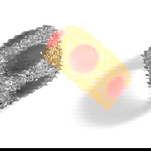 BUCCELLATI: AN 18K BI-COLOR GOLD AND CORAL BRACELET: BUCCELLATI: AN 18K BI-COLOR GOLD AND CORAL BRACELET A hinged cuff of an elaborate foliate motif, set with round cabochon coral, signed Buccellati, Italy, with signed box, inner circumference 6 3/4 in.