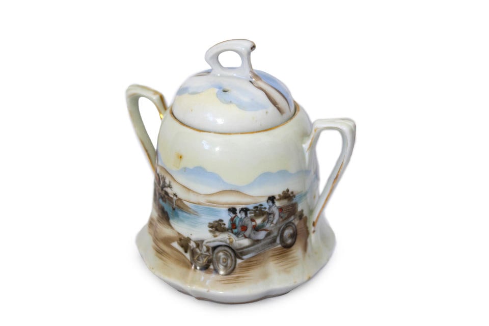 A porcelain, Japanese sugar basin with Veteran Automobile illustration, circa 1920s,: A porcelain, Japanese sugar basin with Veteran Automobile illustration, circa 1920s, hand painted porcelain, unmarked, beautiful landscape scene with 3 geishas' riding in an open top touring car, 5'H 