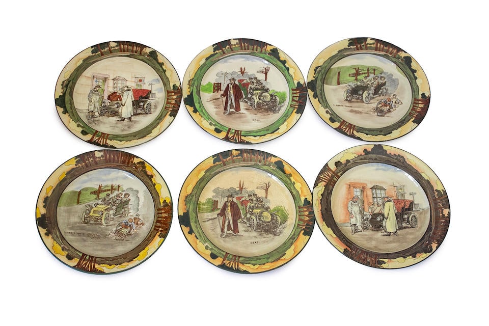 A group of 10, Royal Doulton 'Series Ware' motoring themed plates by George Holdcroft, circa 1906,: A group of 10, Royal Doulton 'Series Ware' motoring themed plates by George Holdcroft, circa 1906, each hand-colored underglaze and decorated with an early humorous motoring scene, titled 'A Nerve Ton