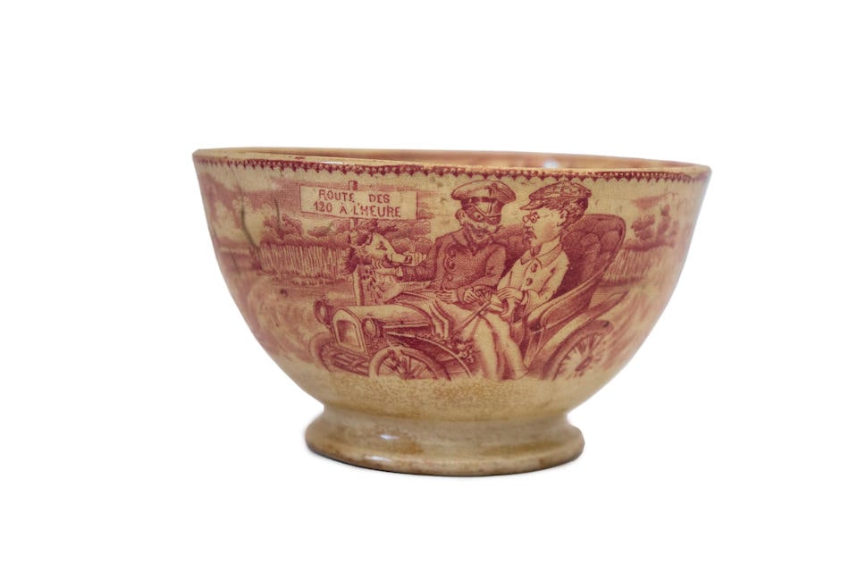 A French tea bowl ornately illustrated with a humorous vintage motorist scene, circa 1905, (1 of 4)