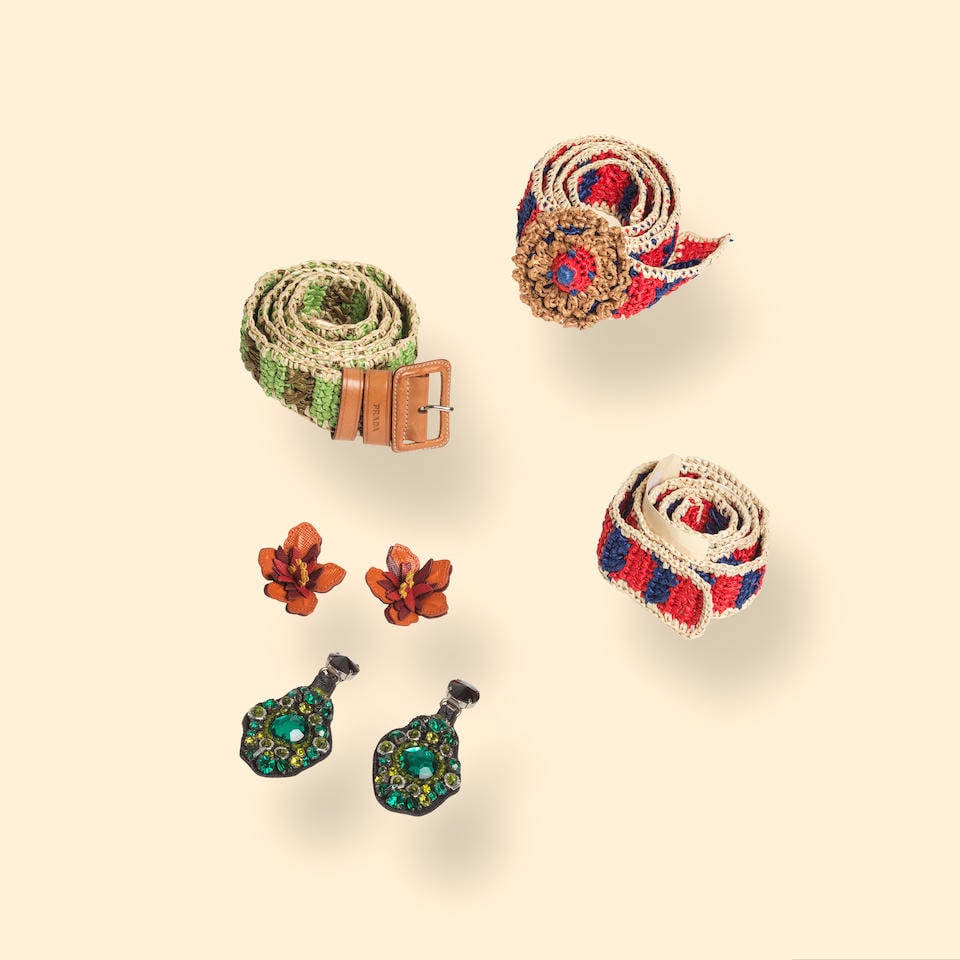 Prada. Two pairs of clip-on earrings and two raffia belts. Prada. Deux paires de clips d'oreille...: Prada. Two pairs of clip-on earrings and two raffia belts. Prada. Deux paires de clips d'oreilles et deux ceintures en raphia. One pair of dangling clips accented with green rhinestones, one pair of l