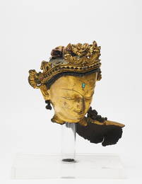 A gilt copper alloy head of Bodhisattva, possibly Avalokiteshvara Nepal, early 14th century
