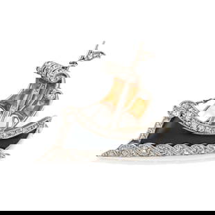 AN ART DECO ONYX, CITRINE, AND DIAMOND SHIP BROOCH: AN ART DECO ONYX, CITRINE, AND DIAMOND SHIP BROOCH Designed as a ship set with calibré-cut citrine sails, a shaped onyx hull, and single and rose-cut diamonds, mounted in platinum and 18k white g