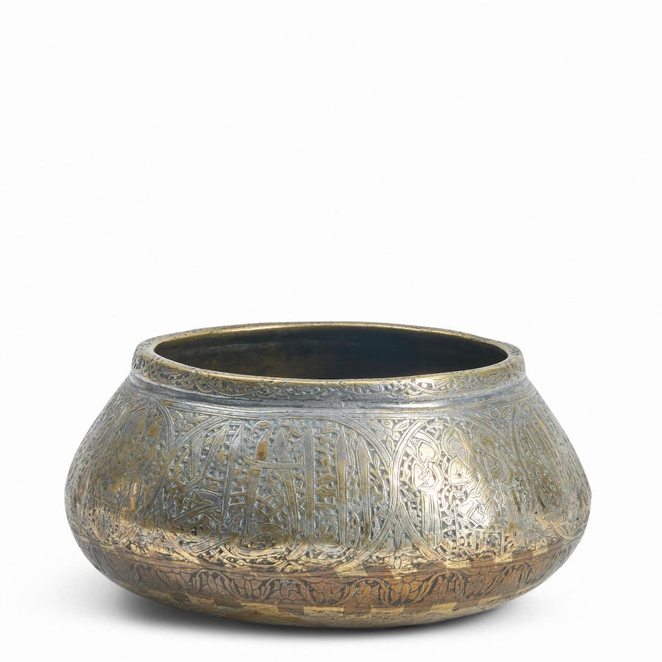 MIXED-METAL ENGRAVED BOWL: MIXED-METAL ENGRAVED BOWL possibly 14th century, tall sides with figural vignettes, ht. 3 3/8, approx. dia. 6 1/4 in. Footnotes: Provenance: Purchased from Boisgirard-Antonini, Paris & Nice, June 16,