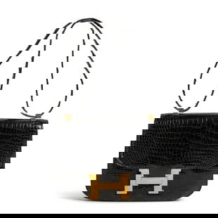 HERMÈS: CROCODILE CONSTANCE 23 1973: HERMÈS: CROCODILE CONSTANCE 23 1973 • Shiny Black Crocodile Exterior and Shoulder Strap • Gold-Plated Hardware • Flap Closure with 'H' Push-Lock • Black Lambskin Lining
