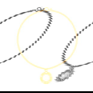 CHANEL: MAGNIFYING GLASS PENDANT NECKLACE 1980'S: CHANEL: MAGNIFYING GLASS PENDANT NECKLACE 1980'S • Gold-Tone Metal • Glass Magnifying Lens with Simulated Pearl Cabochon Detail • Circular Spring-Ring and Lobster Claw