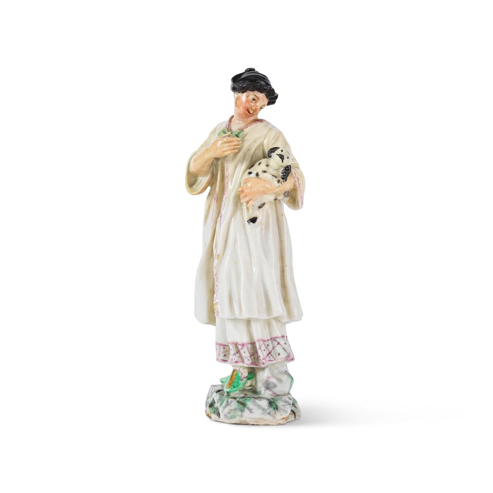 Statuette en porcelaine de Capodimonte ou Buen Retiro représentant une dame tenant un chien...: Statuette en porcelaine de Capodimonte ou Buen Retiro représentant une dame tenant un chien, circa 1755-60 A Capodimonte or Buen Retiro figure of a lady holding a dog, circa 1755-1760 Wearing a b