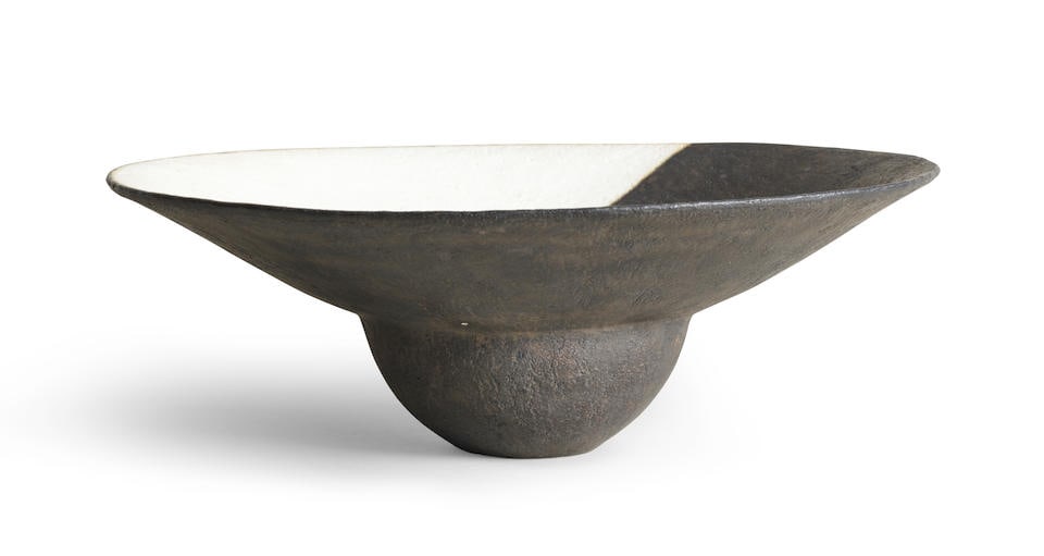 John Ward (British, 1938-2023) Flared-rim bowl: John Ward (British, 1938-2023) Flared-rim bowl Stoneware, matt white and mottled black glazes in a contrasting geometric pattern to the well and rim, underside with black glaze. 11.3 cm high, 32.4 cm