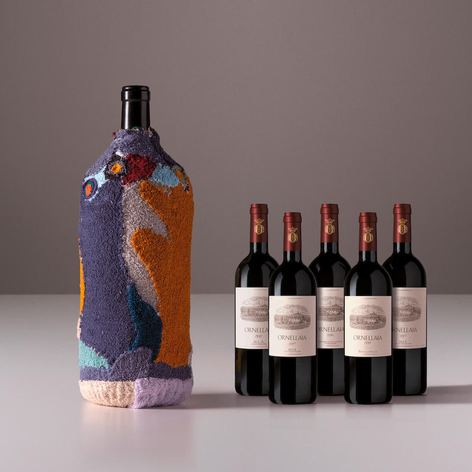Ornellaia 'La Determinazione' 6 liter signed by Pascale Marthine Tayou, 2022 AND Vertical Ornell...: Ornellaia 'La Determinazione' 6 liter signed by Pascale Marthine Tayou, 2022 AND Vertical Ornellaia, 1995 - 1999 (5x 750ml, 1x 6 liter) Region: Tuscany Label: 6 liter is bottle 3 of 10 Footnotes: This