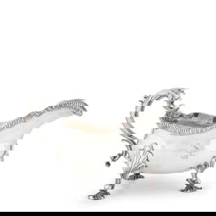 George II Sterling Silver Sauce Boat,: George II Sterling Silver Sauce Boat,  London, 1759, Andrew Fogelberg, maker, the gadrooned rim above a bombe body with double scrolled handle, raised on three shell form feet, crested, ht. 5, lg. 9 i