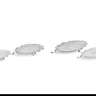 Three George III Sterling Silver Waiters,: Three George III Sterling Silver Waiters, one London, 1757, William and Robert Peaston, maker, shell and scroll rim, raised on pad feet on platforms, dia. 7; one London, 1775, Richard Rugg II, maker,