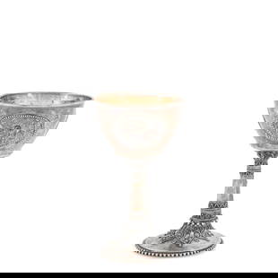 Bezalel Silver Kiddush Cup,: Bezalel Silver Kiddush Cup, Jerusalem, mid-20th century, the hand-hammered bowl with applied medallions centered by a cabochon, the pedestal support with filigree and beading, ht. 5 1/4 in., approx.