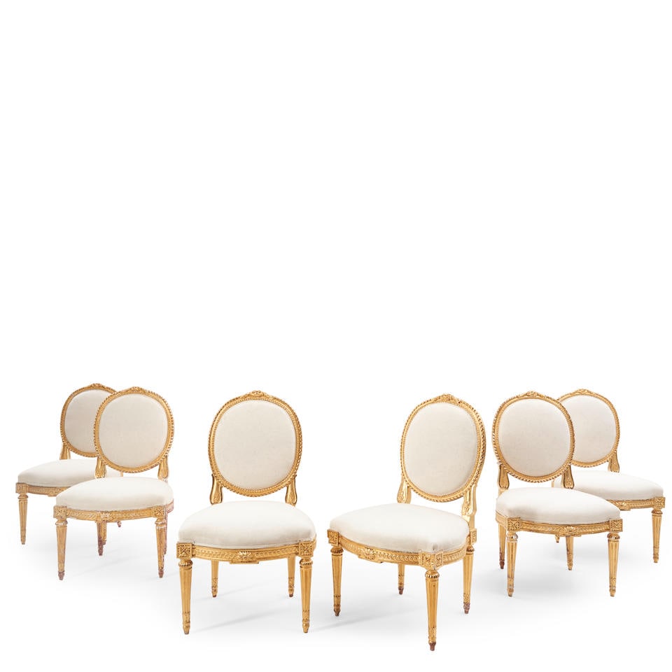 Set of Six Louis XVI Giltwood Chaises, Jean-Baptiste II Tilliard, circa 1770,: Set of Six Louis XVI Giltwood Chaises, Jean-Baptiste II Tilliard, circa 1770, the padded oval backs with ribbon-twist carving surmounted by a rocaille crest, the serpentine seat with conforming rail f