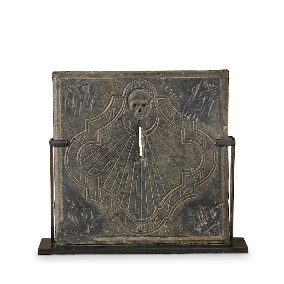A French slate sundial panel Probably late 17th/early 18th century: A French slate sundial panel Probably late 17th/early 18th century The panel of square form with incised cartouche dial decoration, centred by a memento mori skull and inscription 'UNAM TIME', the out