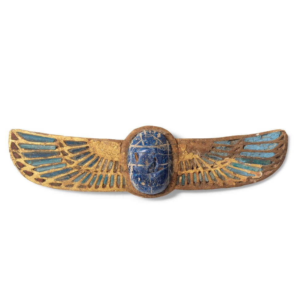 An Egyptian gilt wood and blue glass winged scarab (1 of 2)