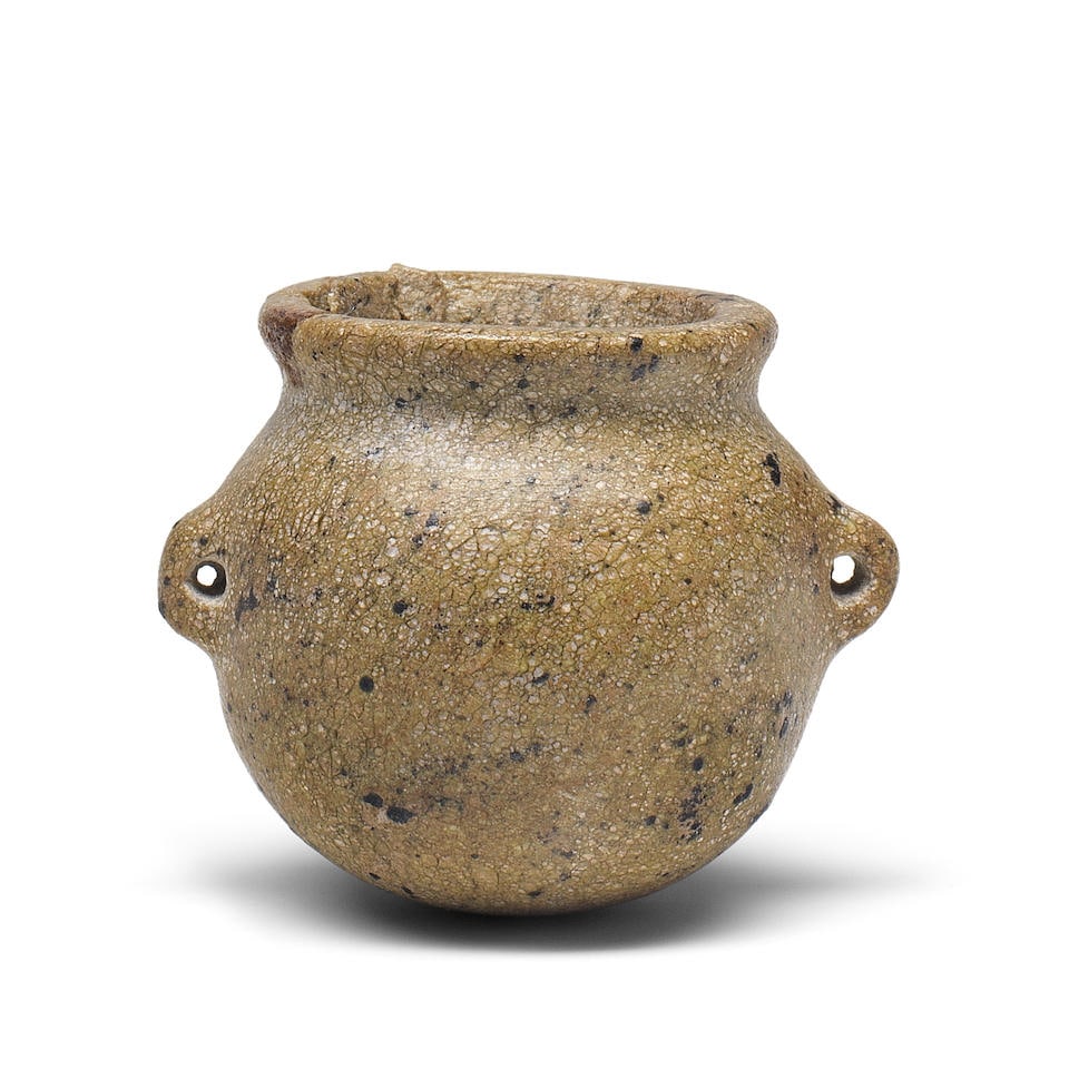 A miniature Egyptian mottled green stone lug-handled globular jar (1 of 2)