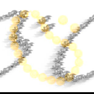 AN 18K GOLD NECKLACE AND EARCLIPS SET, ITALY: AN 18K GOLD NECKLACE AND EARCLIPS SET, ITALYThe necklace designed as a series of round high polish gold beads, with semispherical earclips of similar finish; with Italian Registered Trademark