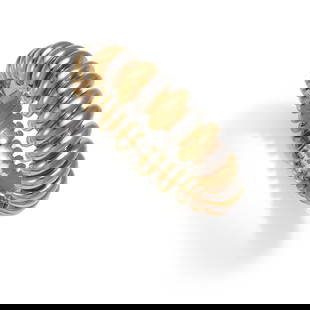 BULGARI: AN 18K BICOLOR GOLD 'CELTICA' BRACELET, ITALY: BULGARI: AN 18K BICOLOR GOLD 'CELTICA' BRACELET, ITALYComposed of alternating gold and white gold arched links; signed BULGARI; with Italian Registered Trademark Number; gross approximate weight