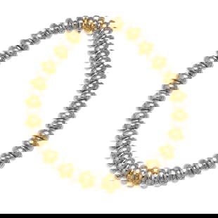 BULGARI: AN 18K BICOLOR GOLD 'CELTICA' NECKLACE, ITALY: BULGARI: AN 18K BICOLOR GOLD 'CELTICA' NECKLACE, ITALYComposed of alternating gold and white gold arched links; signed BULGARI; with Italian Registered Trademark Number; gross approximate weight