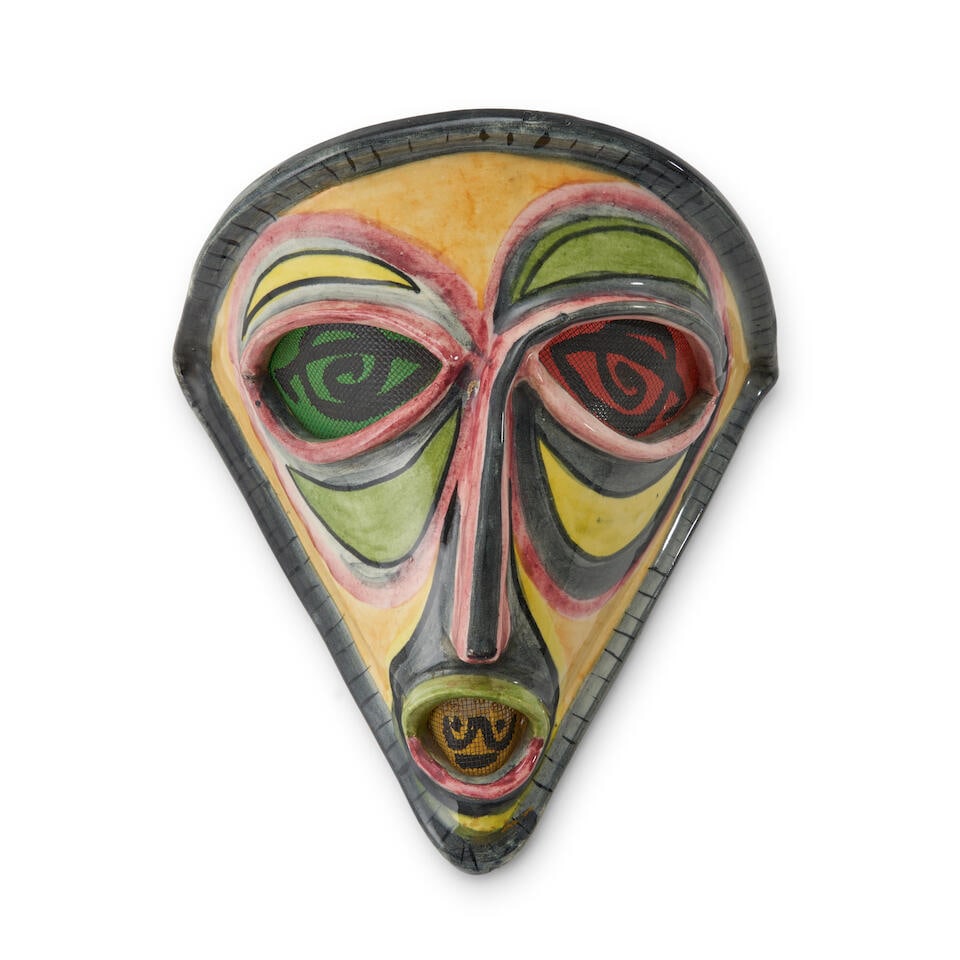 ACCOLAY MASK-FORM SCONCE Accolay, France, c. 1955, glazed ceramic, plastic fiber with embedded w...: ACCOLAY MASK-FORM SCONCE Accolay, France, c. 1955, glazed ceramic, plastic fiber with embedded wire, no electrical wiring, incised mark 'Accolay,' ht. 10, w. 13 5/8, dp. 8 in. Footnotes: Note Followin