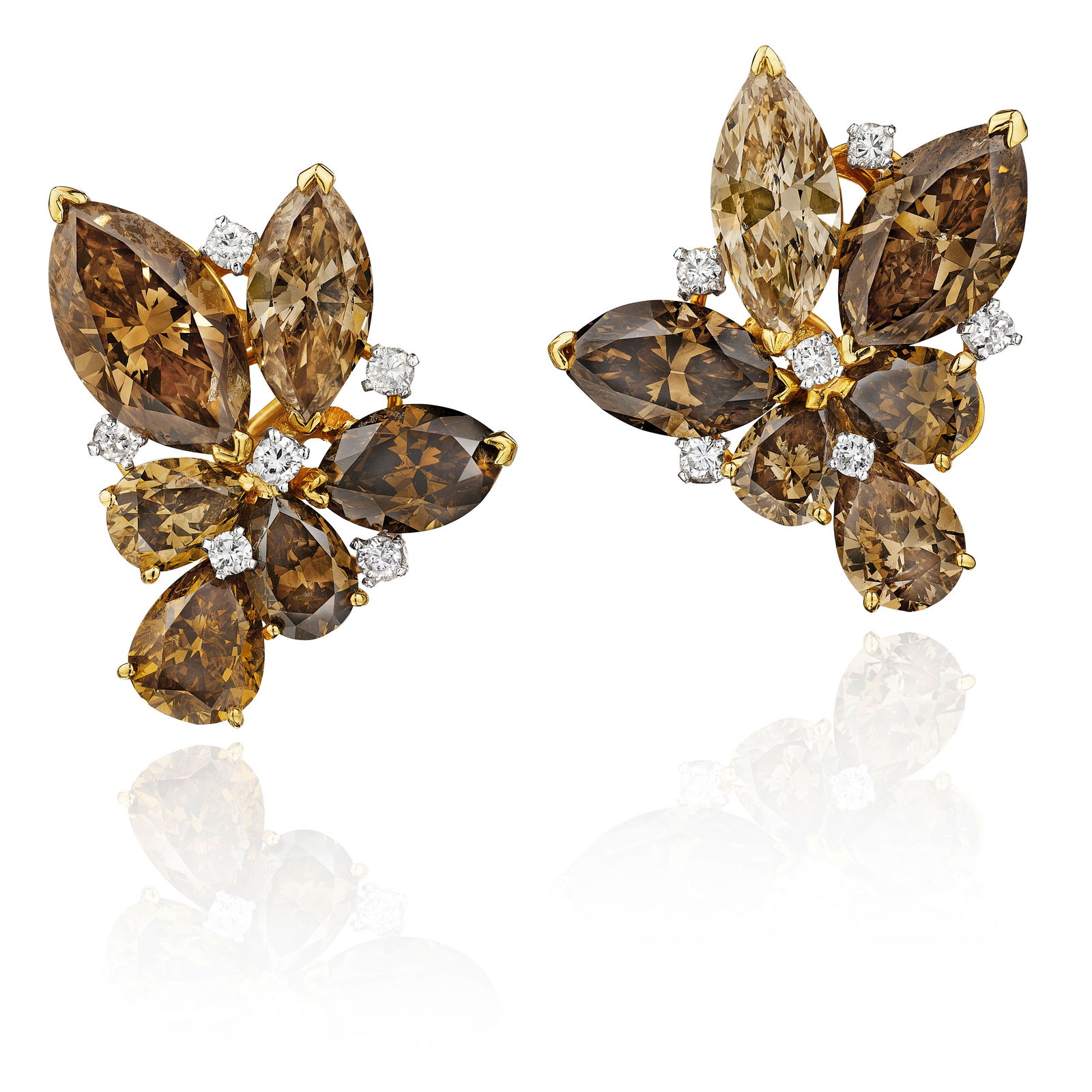 JULIUS COHEN: A PAIR OF COLORED DIAMOND EARCLIPS: JULIUS COHEN: A PAIR OF COLORED DIAMOND EARCLIPS Each designed as a cluster of marquise and pear-shaped colored diamonds of brown tint, accented by round brilliant-cut diamonds; signed Julius Cohen;