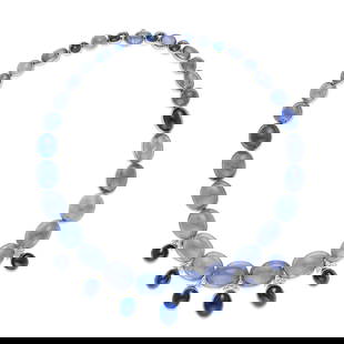 SUZANNE BELPERRON: A SAPPHIRE AND DIAMOND NECKLACE, FRANCE: SUZANNE BELPERRON: A SAPPHIRE AND DIAMOND NECKLACE, FRANCE Composed of graduated cabochon sapphires suspending seven oval-shaped cabochon sapphires at the front, with old European-cut diamond accents;