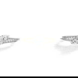 TIFFANY & CO.: A PLATINUM AND DIAMOND SOLITAIRE: TIFFANY & CO.: A PLATINUM AND DIAMOND SOLITAIRE Centering a full-cut diamond weighing approximately 0.72 carats, with old European and full-cut diamond shoulders, signed Tiffany & Co., approximately