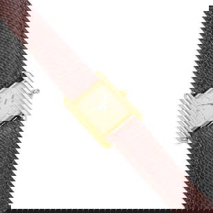 CARTIER: GOLD VERMEIL 'TANK' WRISTWATCH: CARTIER: GOLD VERMEIL 'TANK' WRISTWATCH • Gold vermeil • Quartz movement • 1 round-shaped sapphire cabochon set in crown • Movement, dial, case and strap signed 'CARTIER' ̶